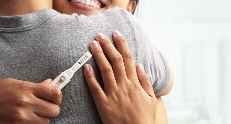 couple test pregnancy fertility assisted happy dr hugging positive flynn michael webpage